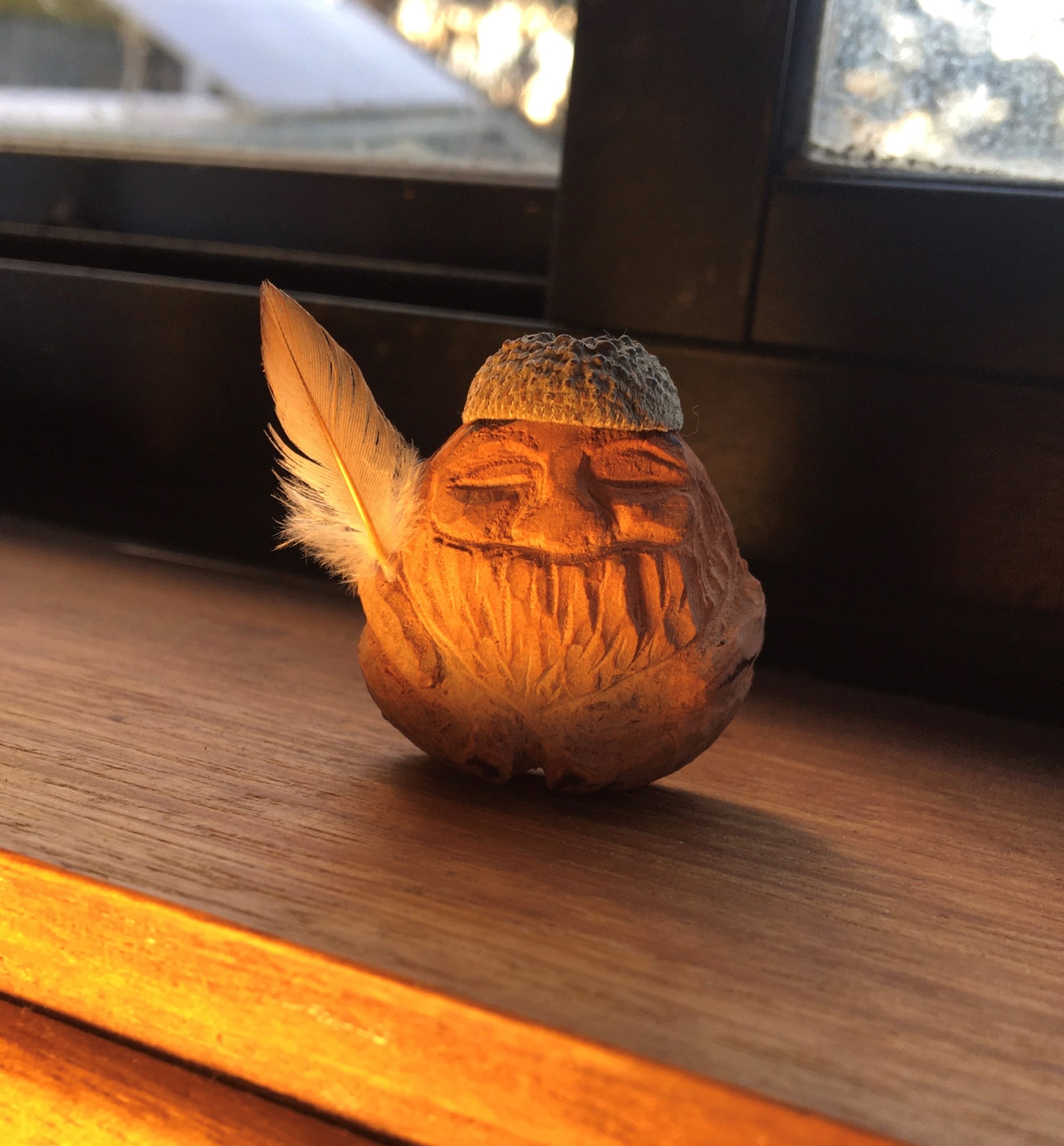 A finished avocado seed carving made during a Forest Folk workshop