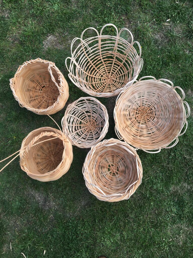 A collection of handwoven baskets made during Forest Folk workshops